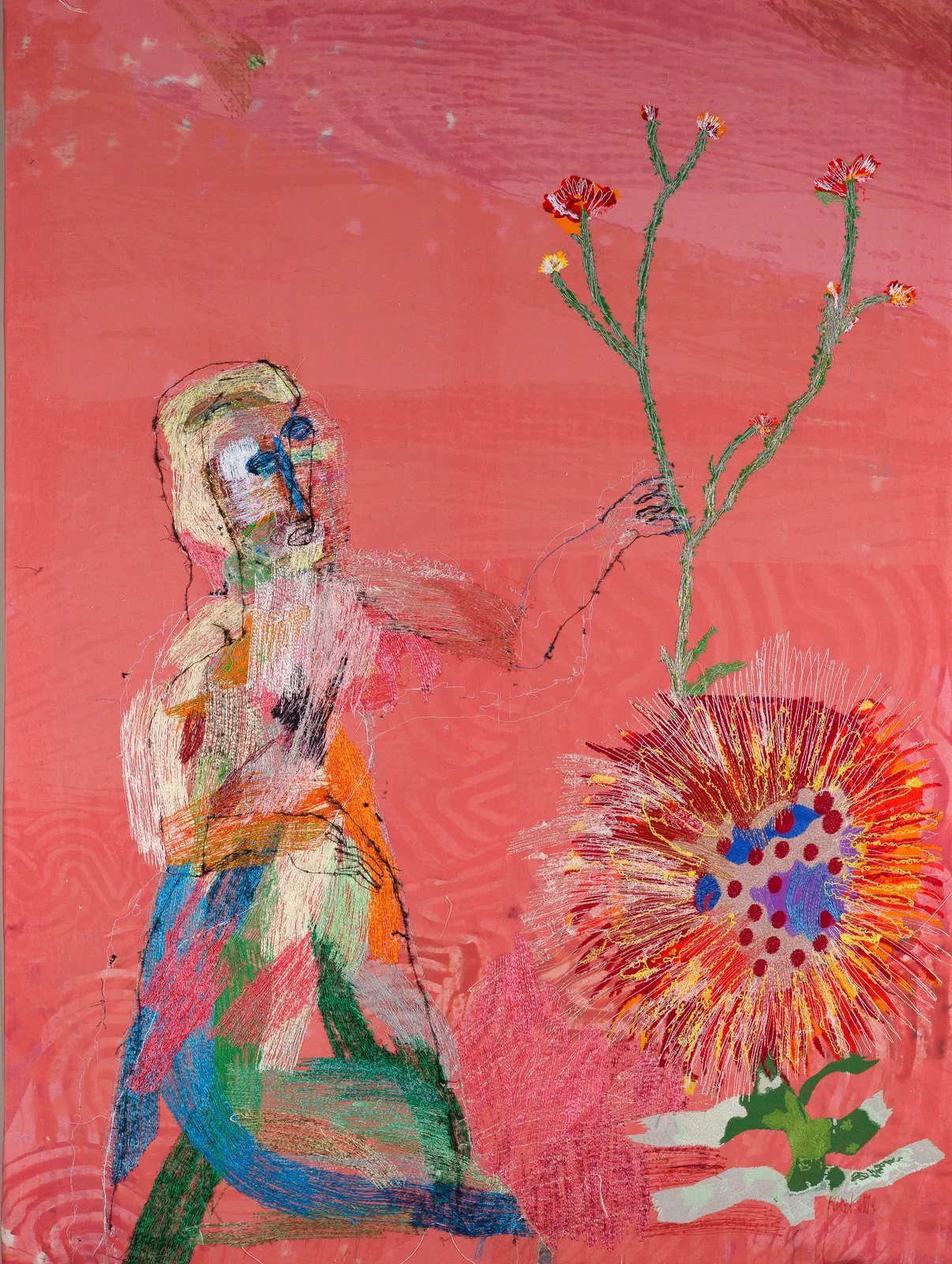 Stitched figure holding a tall flowering stem beside a large red flower head on a coral-pink ground